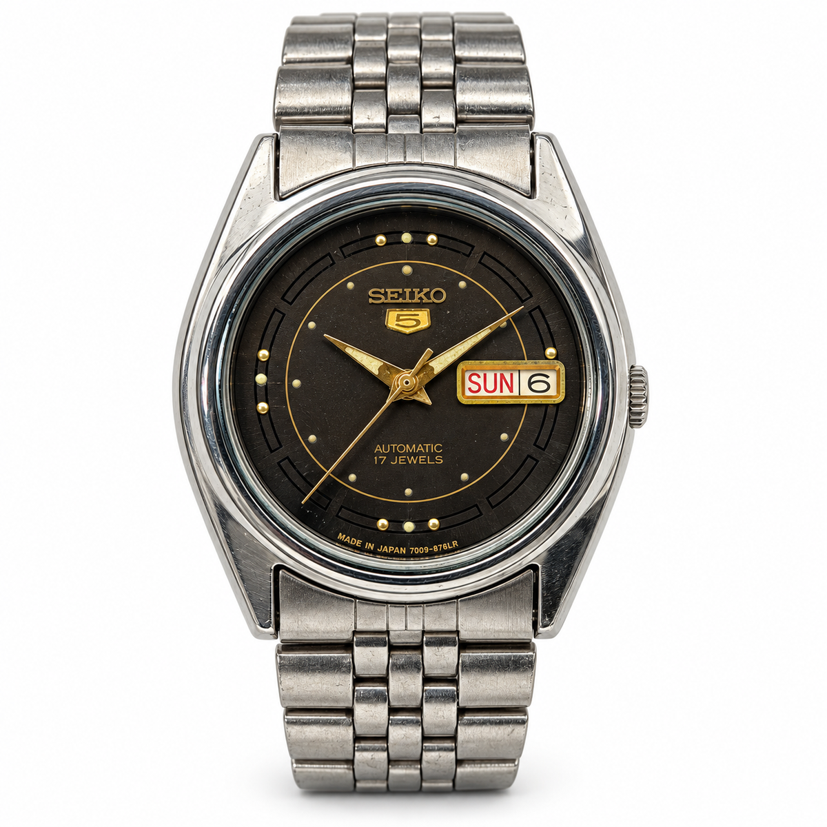 W0090 Seiko 5 7009 dark dial on white background