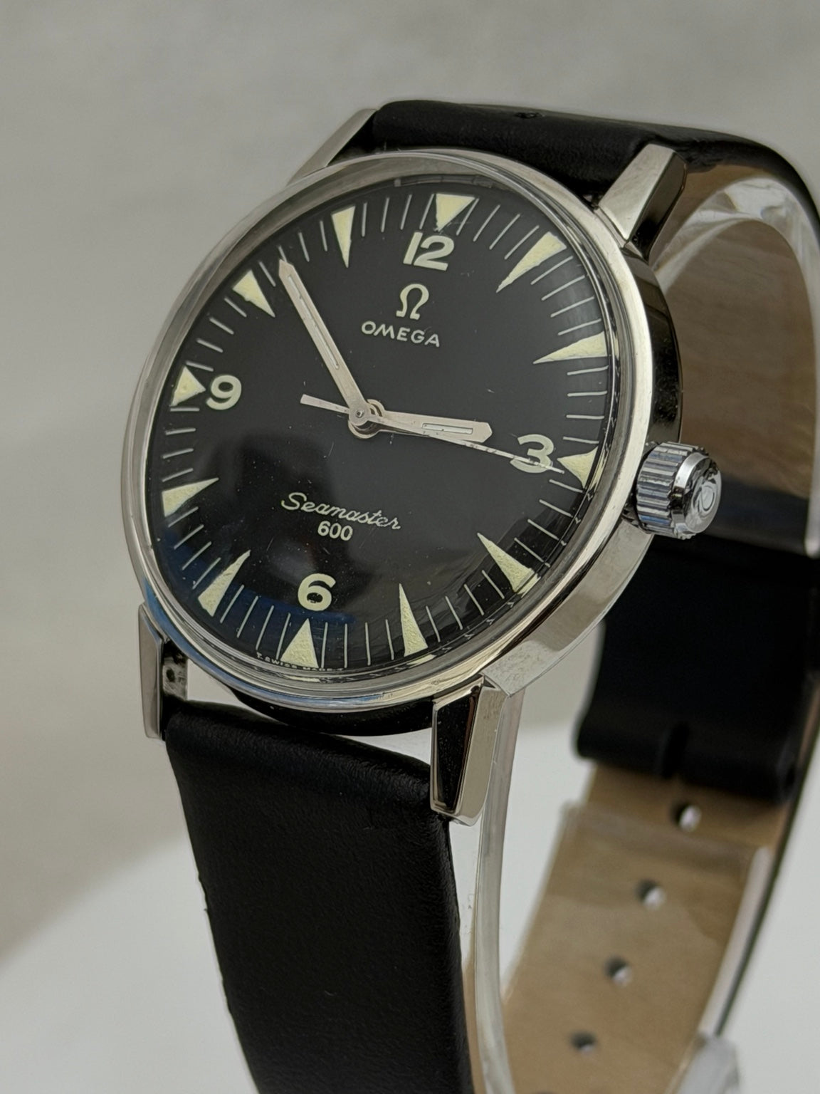 W020 Omega custom-repainted black dial watch – original crown side photo