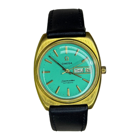 OMEGA Seamaster Automatic Day-Date – Turquoise Dial, Gold-Tone Cushion Case on a white background