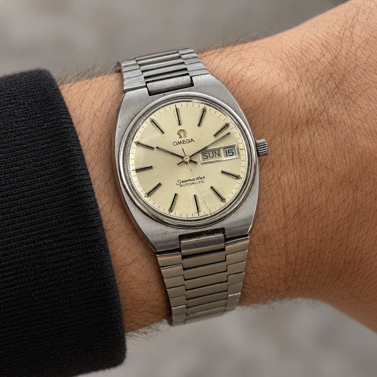 Omega Seamaster W0054 — AI-generated wrist styling view with black sleeve