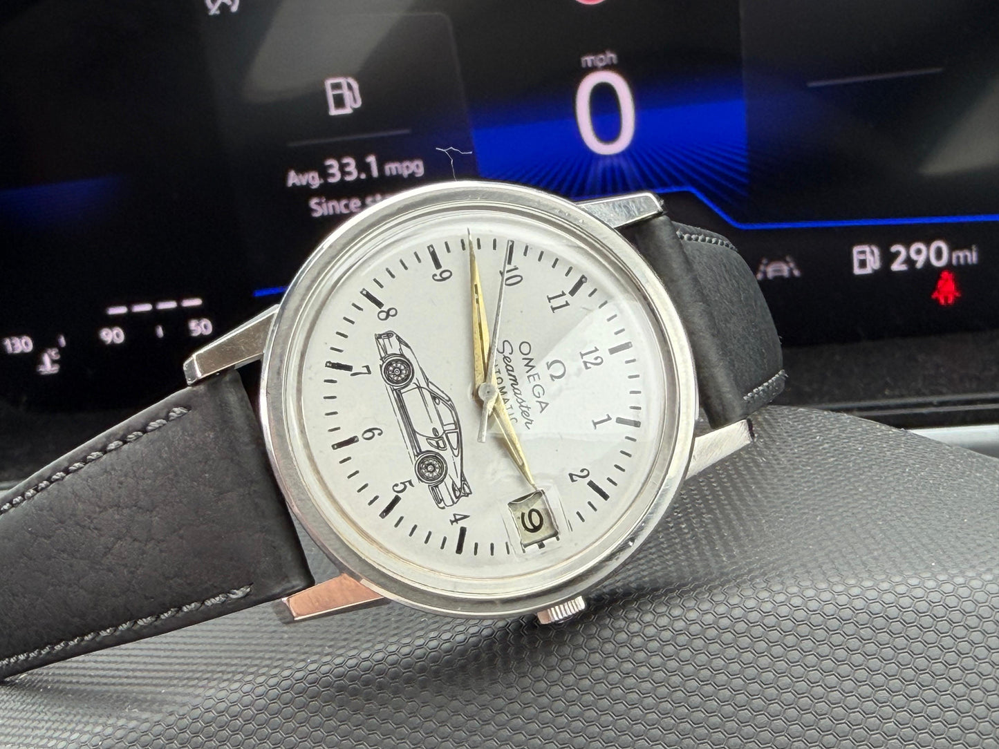 Omega Seamaster White Dial Watch with Gold Hands and Black Strap with Car Motif