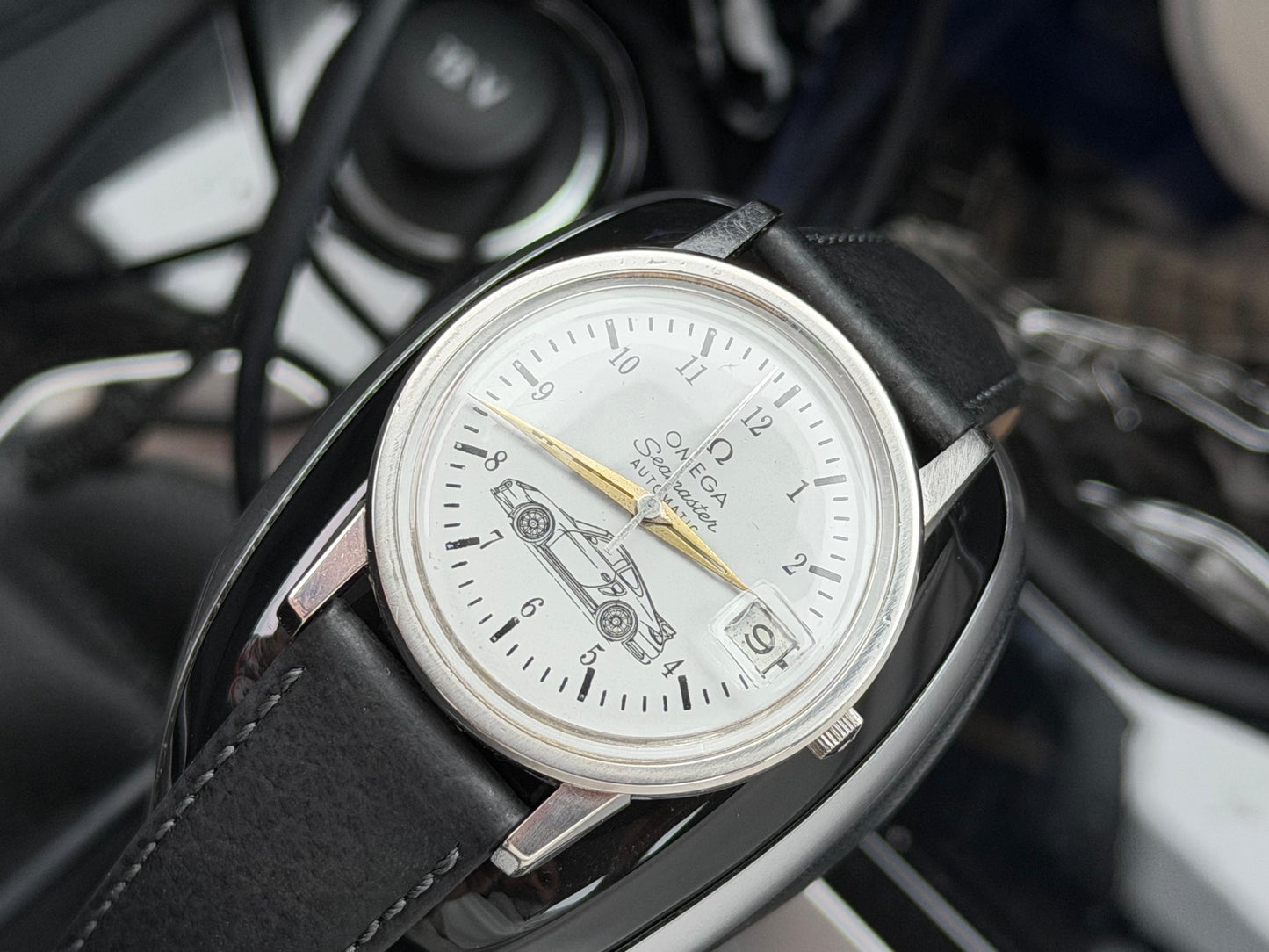 Omega Seamaster White Dial Watch with Gold Hands and Black Strap with Car Motif