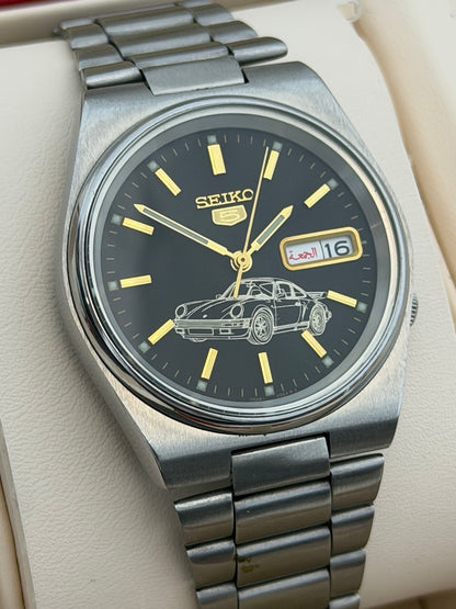 Vintage Seiko 5 automatic watch black dial with sports car motif front view